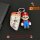 Bmw 3 series car key cover featuring mario design, paired with a mario figurine keychain, set against a sleek black backgroun...