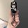 A hand holds a stylish black car key cover featuring a cute cartoon character with bunny ears, designed for chery tiggo model...
