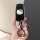 A hand holds a sleek black key cover featuring a white hello kitty design, compatible with lincoln corsair models like nautil...
