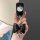 A hand holds a sleek black tpu key cover featuring a hello kitty design, adorned with a glittery black bow and a shiny heart ...