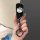 A hand holds a sleek volkswagen id.3 car key cover featuring a hello kitty design, combining functionality with playful charm...