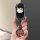 A hand holds a sleek black car key cover featuring a white hello kitty design, compatible with kia models like sportage, k5, ...