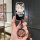 A hand holds a stylish lincoln corsair car key cover featuring a cute hello kitty design with floral accents and a fashionabl...