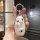 A hand holds a white car key cover featuring a cute cartoon dog design with a paw print, designed for leapmotor t03, c11, and...