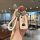 A hand holds a stylish honda cr-v key cover with a white braided strap and decorative charm, featuring chinese characters for...