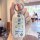 A hand holds a white roewe rx5 car key cover featuring a cute doraemon design with three expressions and the text doraemon wo...