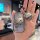 A hand holds a stylish key cover for the changan cs75 plus, featuring a soft tpu design with a cute cartoon bear and the phra...
