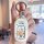 A hand holds a white honda inspire car key cover with a playful design featuring (little rich lady) and the phrase ...