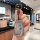 A hand holds a sleek, silver toyota camry car key cover featuring a snoopy design with the text so excited to be rich. the st...