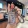 A hand holds a stylish toyota camry key cover featuring a cute cartoon design with the text , paired with a braided l...