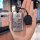 A hand holds a sleek, metallic roewe rx5 plus car key cover featuring a cartoon character with the text so nervous, about to ...