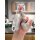 A hand holds a porsche key cover for cayenne, macan, panamera, and taycan, featuring a sparkling mickey mouse charm and a sle...