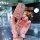 A hand holds a sparkling pink toyota key cover for camry, corolla, rav4 & avalon, featuring a butterfly charm and elegant des...
