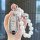 Elegant infiniti q50l key cover with sparkling rhinestones and pearl accents, offering stylish protection for your car keys.