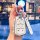 A hand holds a cadillac xt5 key cover with a sleek, diamond-embellished design and a matching key fob featuring (peace) en...