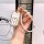 Elegant white honda key cover with gold accents, featuring a braided strap and decorative charms, perfect for cr-v, accord, c...