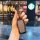 A hand holds a sleek, black toyota sienna key cover for the 2024 grandvia and alphard models, showcasing its modern design ag...