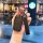 A hand holds a sleek black honda key cover with a leather strap, designed for models like accord, civic, and cr-v, showcased ...