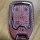 Elegant chevrolet gmc yukon key cover with a luxurious pink leather design, featuring a textured pattern and sleek metallic e...