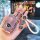 Elegant pink volvo key cover for xc60, s90, s60, xc90, xc40 & v90, featuring a glittery texture and decorative keychain with ...