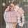 A hand holds a pink, glittery lynk & co 08 key cover with a beaded charm, showcasing its premium leather design and sleek, mo...