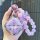 A hand holds a sparkling purple wuling binguo key cover for kiwi ev & yun duo, featuring a glittery design and decorative bea...