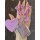 A hand holds a stylish lexus es200 key cover featuring a glittery pink design, accompanied by a purple heart-shaped tag label...