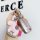 A hand holds a lincoln corsair key cover featuring a pink leather rocking horse charm with silver accents, set against a back...