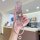 A hand holds a pink volkswagen key cover for bora, passat & tiguan l, featuring a braided strap and decorative charms, set ag...