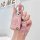 A hand holds a pink chevrolet key cover for cruze, malibu xl & trax, featuring a glittery finish and a matching teddy bear ch...