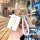Elegant tank 300 key cover with gold accents and a braided white strap, showcased in a cozy café setting.