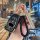 Elegant black leather subaru forester key cover with gold accents, featuring a braided lanyard and diamond-embellished keycha...