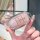 A hand holds a pink, glittery toyota key cover designed for camry, corolla, and rav4 models, showcasing its sleek, premium le...