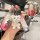 A hand holds a stylish ideal l7/l8/l9 max leather key cover with a gradient pink and silver finish, featuring a cute bear cha...