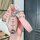 Elegant pink nissan key cover for 14th-gen sylphy & x-trail, featuring a sleek design with a matching wrist strap and sparkli...