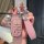 Elegant pink leather key fob cover for jeep compass, cherokee, and grand cherokee, featuring a sleek design with a matching s...