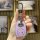 A hand holds a purple toyota corolla ex key cover with a metallic carabiner, showcasing its sleek design and search button ag...
