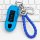 Blue porsche key cover for macan, cayenne, panamera, and 718, featuring a braided rope and sleek design, displayed on a keybo...
