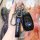 A hand holds a sleek black subaru key cover, featuring the brand logo and functional buttons, designed for models like xv, fo...
