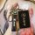 A hand holds a bmw key cover featuring genuine leather with the iconic bmw logo, designed for models like x5 l, x3, x5, x6, a...