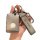 A hand holds a sleek, metallic volvo key cover with a soft tpu design, featuring a shise branded leather strap and a volvo lo...