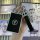 A hand holds a sleek black ninebot b30c/b80/c60/n70c nfc card holder with a silver logo, attached to a keychain featuring a n...