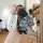 A hand holds a tailing biaobing x3 key cover, showcasing its sleek white silicone design with three buttons. attached is a cu...
