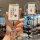 A hand holds a premium magnetic card key holder with a front view showing japanese-style text and a red diamond logo, featuri...