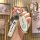 A hand holds a white nissan key cover with a sleek design, featuring the nissan logo and a matching keychain, showcased again...
