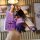 A hand holds a purple buick envision s gs key cover (2021–2022) with a gradient design, accompanied by a cute bear-shaped cha...