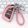 Rose gold cadillac ct5 key cover with braided pink leather strap, featuring a sleek design and functional buttons, compatible...