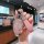 A hand holds a stylish pink gac trumpchi yingbao key cover for gs4, gs8, m8, and zongshi models, featuring a sleek design wit...