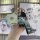 A hand holds a sleek suzuki jimny key cover with a metallic finish, accompanied by a quirky bear keychain and a stylish leath...