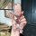A hand holds a pink benteng xiaoma 2024 key cover featuring a cute horse design, adorned with a decorative bow and sparkling ...